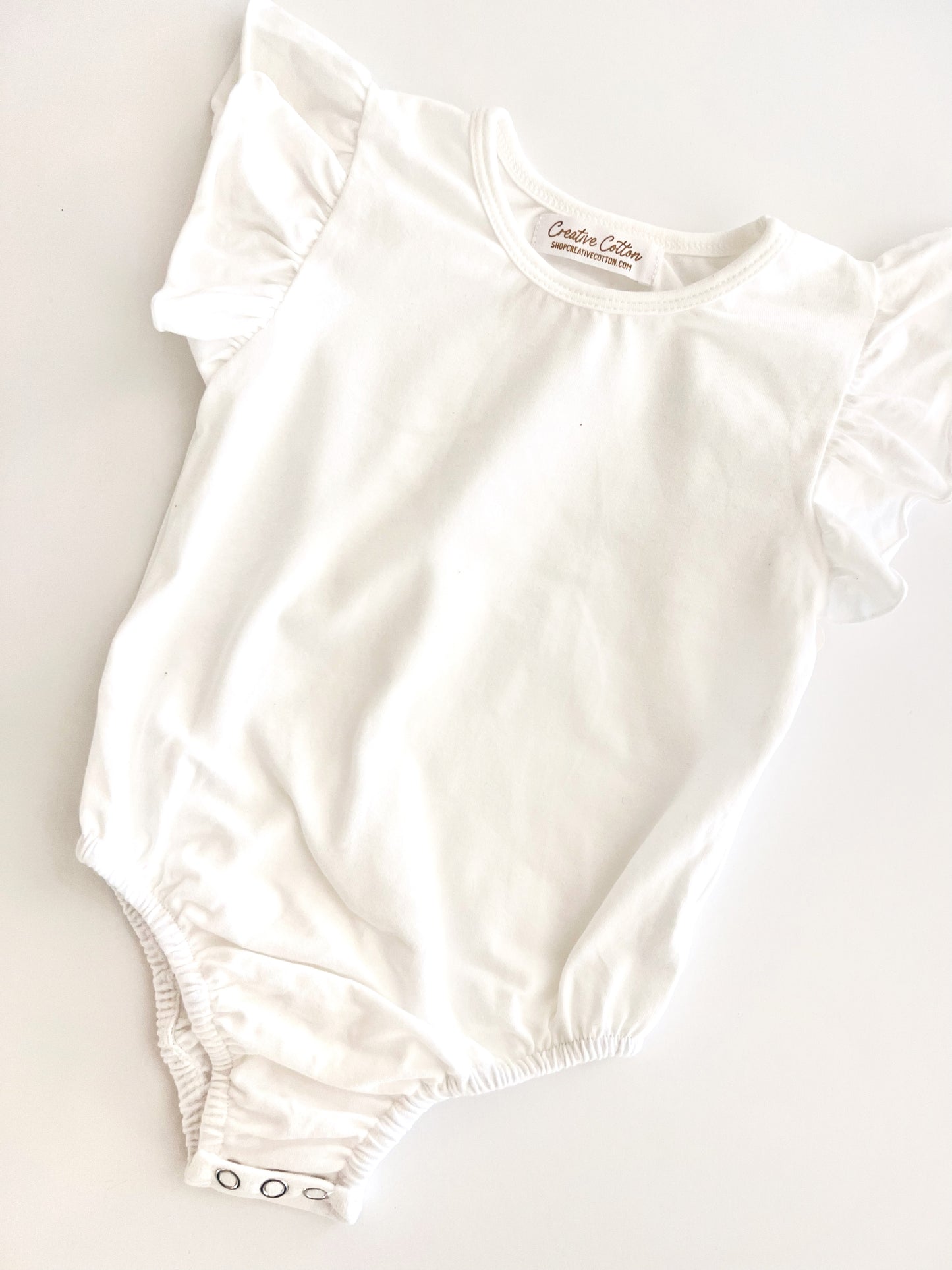 Ruffled Onesie in Star (off-white)